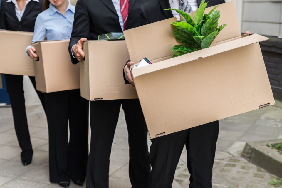 Close-up,Of,Unemployed,Businesspeople,Carrying,Cardboard,Boxes
