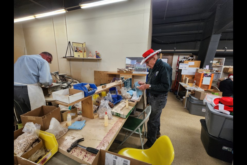 Marv Van Peursem, project coordinator for the Longmont Kiwanis Club's "Toy for Kids," assembles a toy on Tuesday.