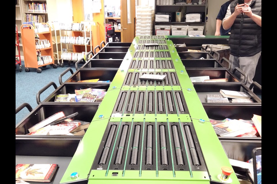 Materials are sorted with the new machine at the Longmont Library.