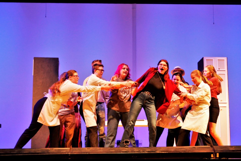 The cast of "Freaky Friday" rehearses the opening number on Tuesday at Longmont High School.