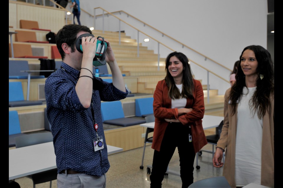 Members of UCHealth and Rendever experience the virtual reality videos created by Innovation Center students.