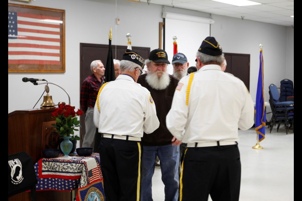 Vietnam War veterans receive pins thanking them for their service Tuesday in Longmont.
