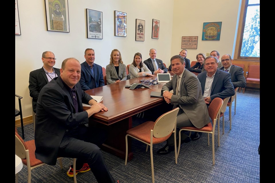 A group of Executives Partnering to Invest in Children members/business leaders meeting with Governor Polis to discuss child care and early childhood issues and policies