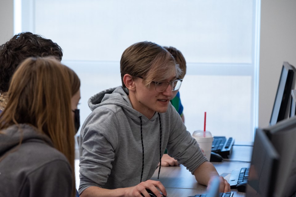 Silver Creek senior Joe Looney teaches his last game design class on Friday at the Innovation Center. The course was six weeks and he taught it to 25 of his peers.