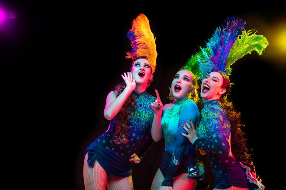 beautiful-young-women-carnival-stylish-masquerade-costume-with-feathers-black-wall-neon-light