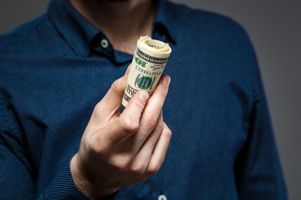 close-up-man-s-hands-holding-money