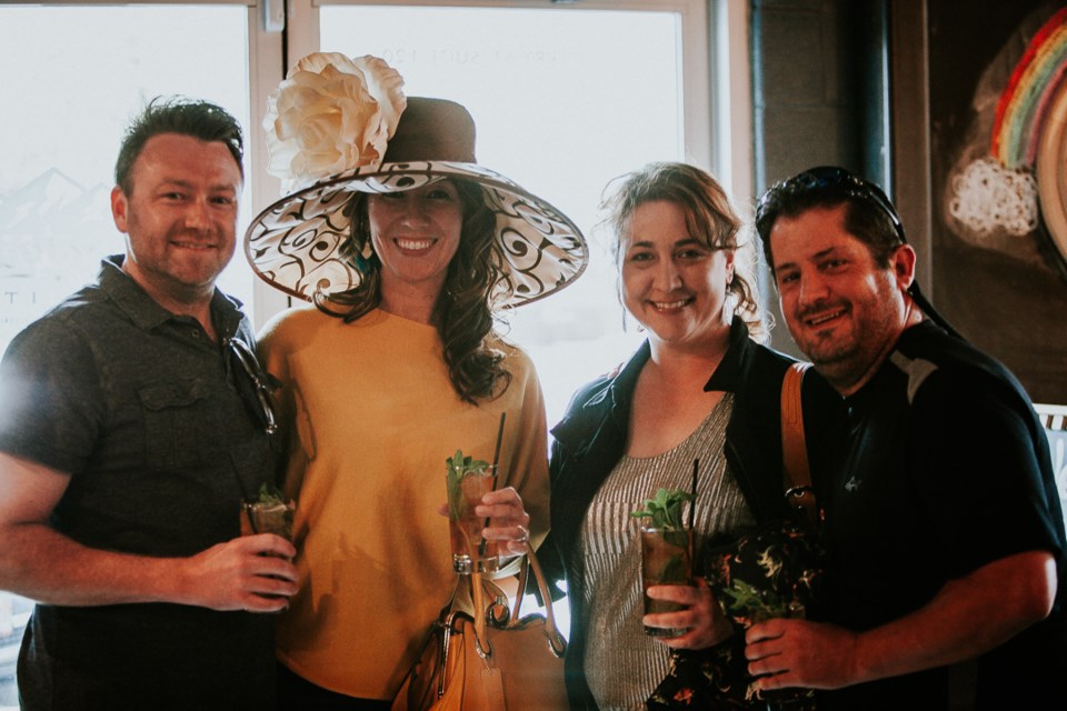 Left to right: Adam and Caroline Hornbacks with Beth Mccracken and Mike Pal at a past Longtucky Derby party in Longmont's Abbott and Wallace Distilling | Photo by Lachlan Quintana 