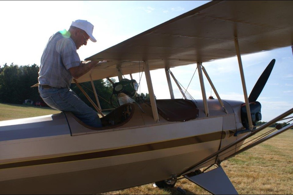 Jack Greiner climbs into his Pietenpol for a flight to  to an annual convention in Wisconsin. 
(Photo courtesy of Richard Hawley)