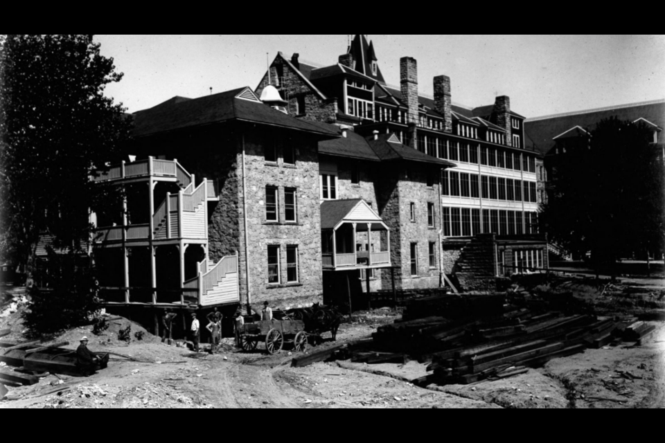 The Union Printers Home under construction in 1891. A horse-drawn wagon is alongside the building, with workers standing for the photo. Piles of timbers and building materials are seen on the ground.

Rocky Mountain Public Media