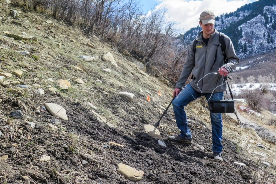 Eugene Vessels uses a Gazomat device to check methane levels by the abandoned Hubbard Creek mine shaft in the North Fork Valley on Wednesday, March 17, 2021.