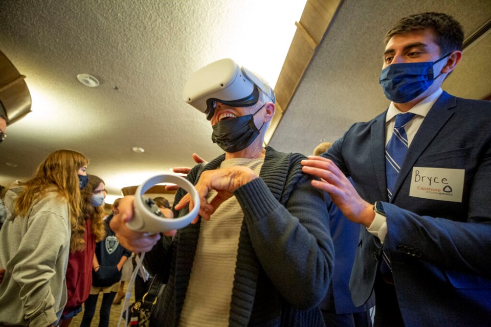 Bryce Gelok helps Wanda Ford take a virtual tour of Golden, a demonstration of his team's Capstone Design project at Colorado School of Mines. Dec. 2, 2021.