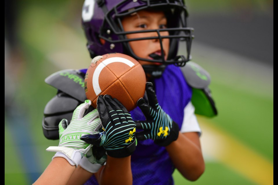 Youth sports such as football can be affordable for families at the very basic level, but things like playing with a club program, adding personal training, premium equipment and attending camps can quickly add up to big dollars, especially with the impact of inflation. (Photo by Courtney Oakes/Sentinel Colorado)