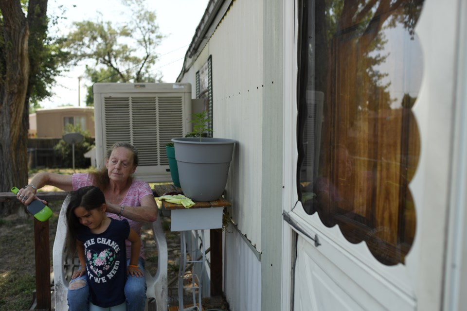 CANON CITY, COLORADO - AUGUST 30: Dawn Ketcham does her granddaughter’s hair, four-year-old Mia Massey, at Central Manufactured Home Community on August 30, 2021 in Canon City, Colorado. Ketcham is upset that space rent for her manufactured home recently increased. (Photo by RJ Sangosti/The Denver Post)

The Denver Post