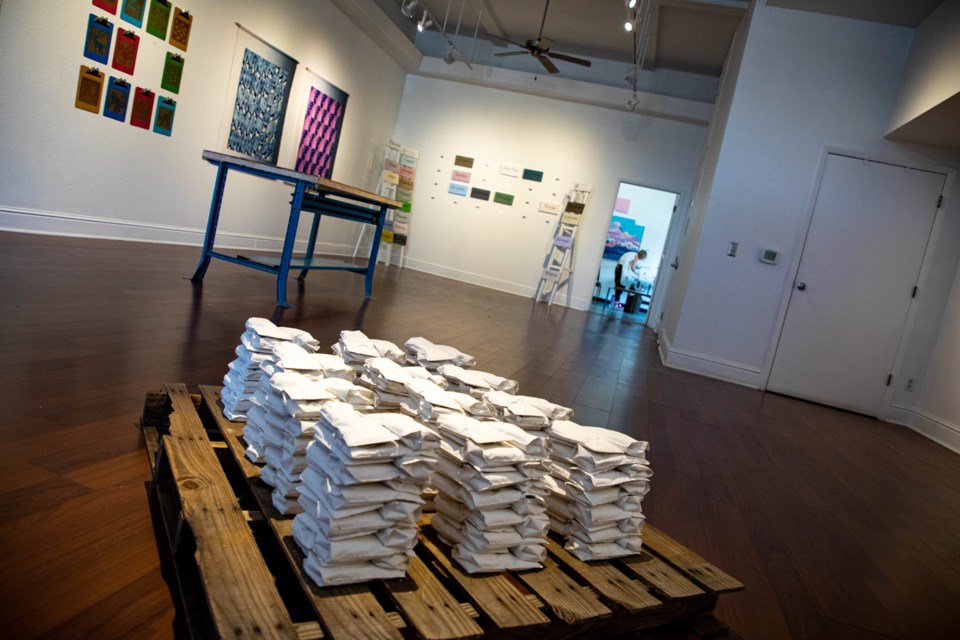 Alexandra Knox's Stockpile quanitifies nursing and breastfeeding as a product through plaster-cast breastmilk bags on a shipping pallet.