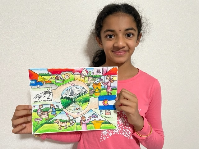 Sree from Erie, a 2021 Keep It Clean Art Contest participant, displays her award-winning entry.
