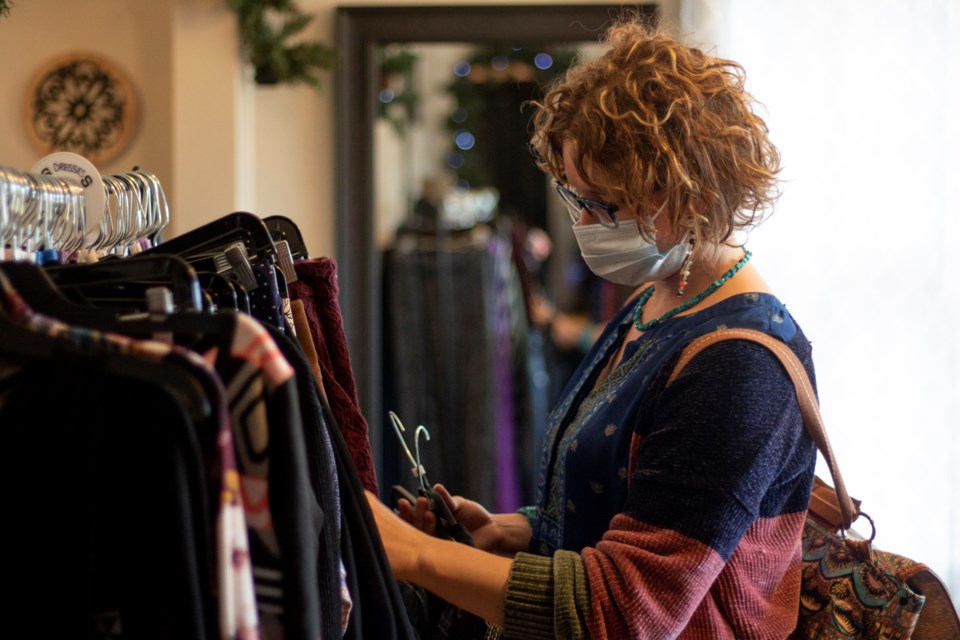 Longmont resident Ailsa Bier shops at Elevated Communities, a thrift store in Longmont, on Dec. 3. Elevated Communities is a retail branch of the nonprofit Elevated Supports and provides employment opportunities to adults with developmental and intellectual disabilities. Photo by Ali Mai