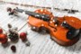 Close-up Photo Of Violin, Musical Notes and Christmas decoration