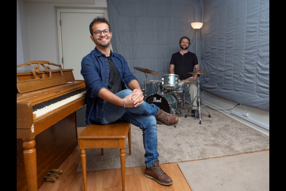 Mountain Time Music School co-founders Matheus Pagliacci, director of marketing, and Benjamin Sevy, director of education, pose for a photo inside of the Longmont school on March 17. Photos by Ali Mai | Longmont Leader