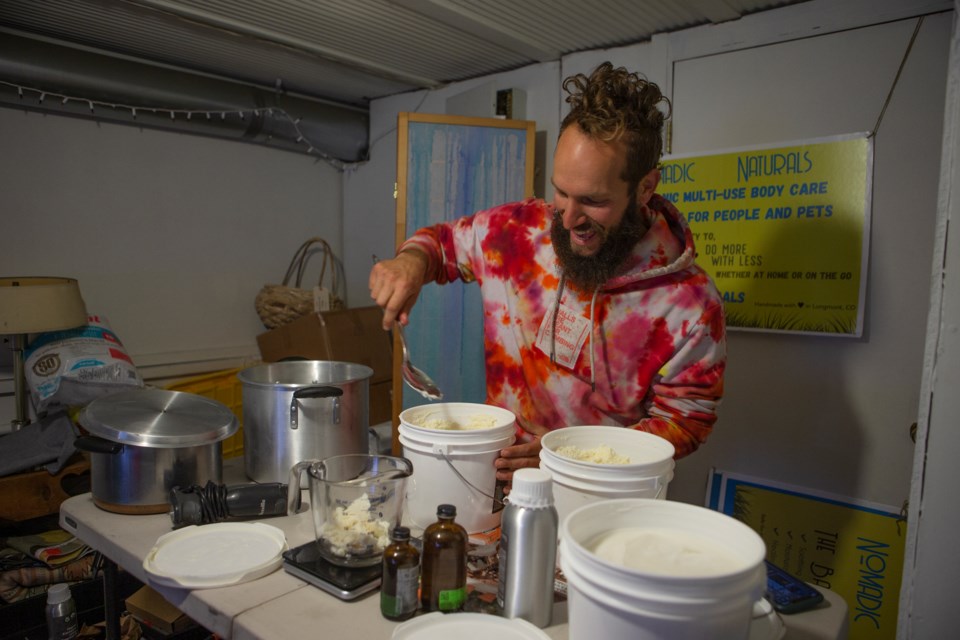Nomadic Naturals owner John Alex Vespa on Oct. 14 makes a small batch of The Balm, a multi-use moisturizer, on the top floor of Maker General on Main Street. Photo by Ali Mai