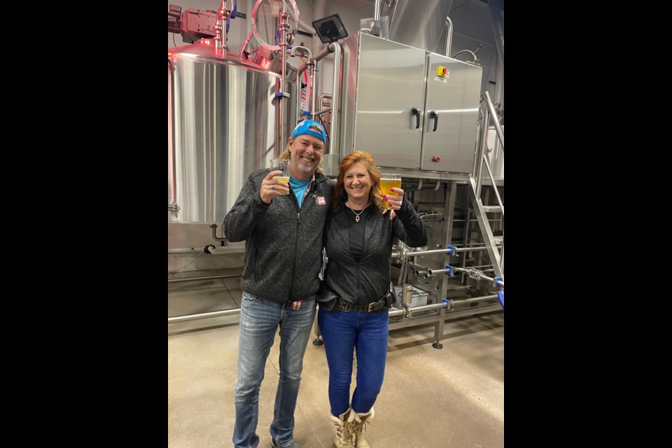 Steve and Leslie Kaczeus say cheers with the Pickle Me Up beer