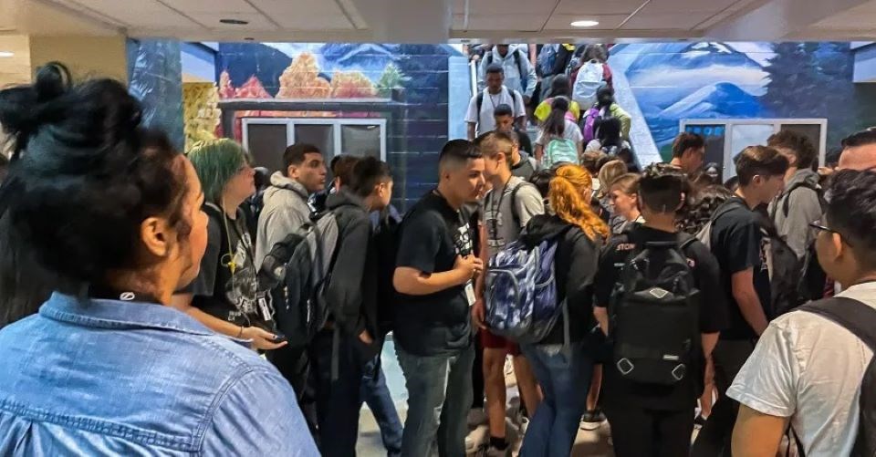 Shena Lopez, an attendance advocate at Greeley’s Northridge High School, monitors the hallway during a recent passing period.