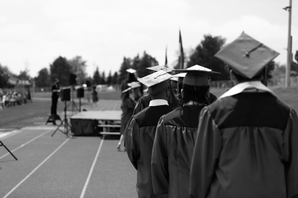 Niwot High School Class of 2021 graduates line up to receive their high school diplomas.