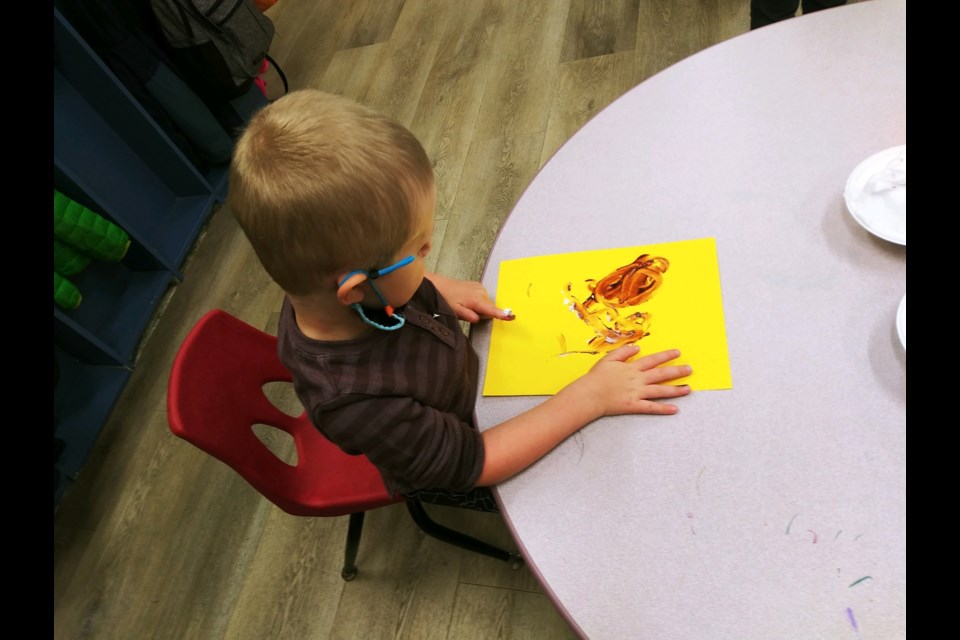 Orion enjoying messy art time.