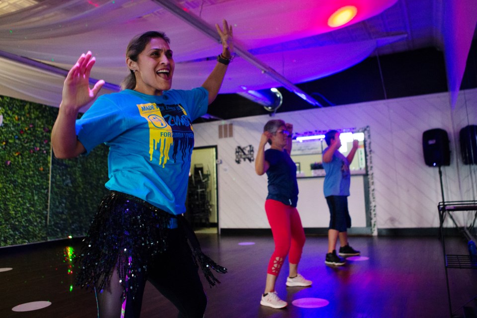 Owner of Noa Noa Fitness Club in Longmont Iveth Galindo(left) leads an evening Zumba dance class on May 7. Photo by Ali Mai | ali.mai.journo@gmail.com