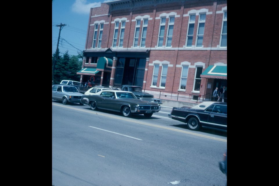 A color slide of the Dickens Opera House dated from 1979, likely taken by Virginia Estes. The image is part of the Longmont Museum historical archives.