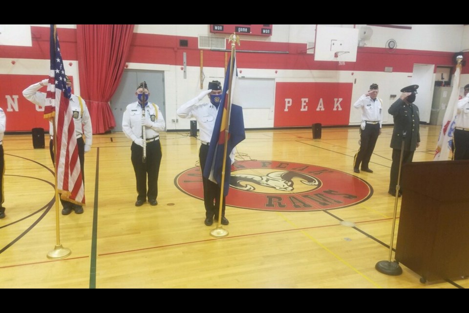 Honor guard performs at Longs Peak Middle School during Veteran's Day celebration