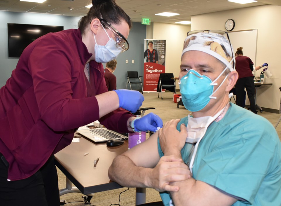 2020_12_18_LL_UCHealth_LPH_COVID_Vaccine Shot John Bradley DSC_0591 (1)