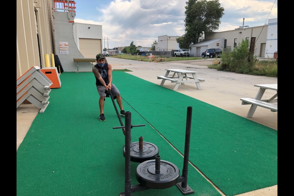 Joseph Mendoza pulling sled outside. (Photo by Macie May)