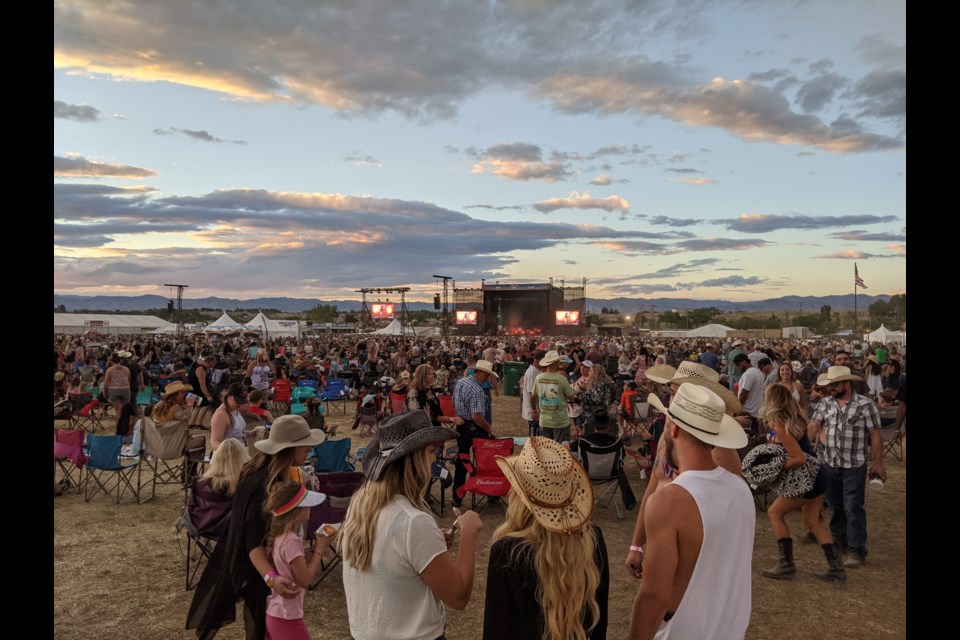 Thousands gathered for a three-day country music festival in western Colorado in late June. Cases of the delta variant of the coronavirus are spreading quickly in the area, but the public health department said that, by the time the risk had become clear, it was too late to cancel Country Jam. (Rae Ellen Bichell/KHN)