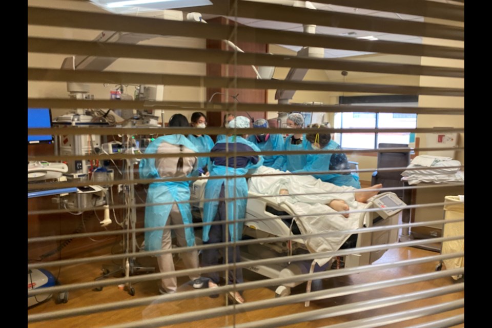 Nurses at Billings Clinic prepare to turn a patient from his stomach to his back in the hospital's intensive care unit on Sept. 17. (Billings Clinic)