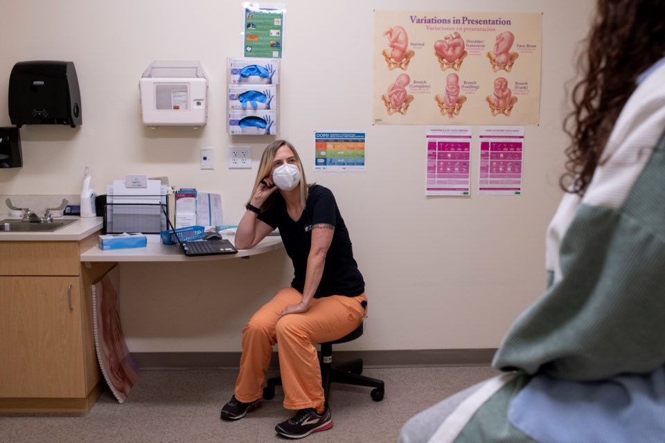 Shaunti Meyer, medical director at the STRIDE Community Health Center in Aurora, Colorado, discloses her sexual orientation to patients when it feels appropriate. LGBTQ+ patients often deal with stigma in health settings. âThey feel more connected because Iâm part of the community,â Meyer says. (Rachel Woolf for KHN)
