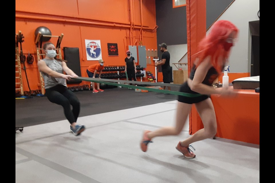 Anika Pivetta, left, and Anabella Heinrichs work out at Warrior Playground in Longmont. on Monday, Nov. 23, 2020.
(Photo by Matt Hagerman)