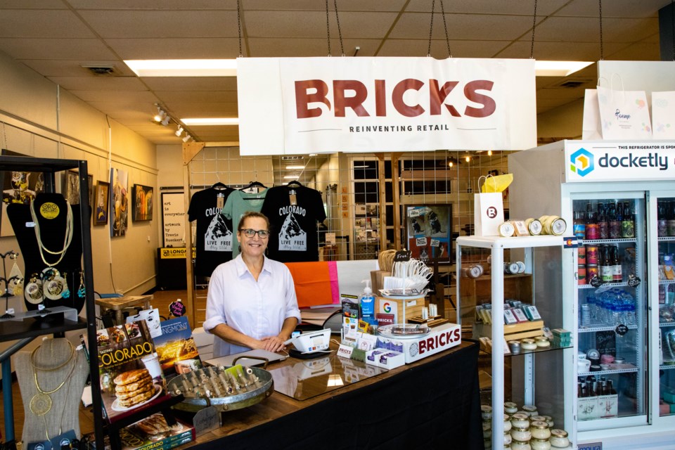 Bricks Retail is moving into its permanent home before the month is out. (Bricks owner Jennifer Ferguson featured at the counter)