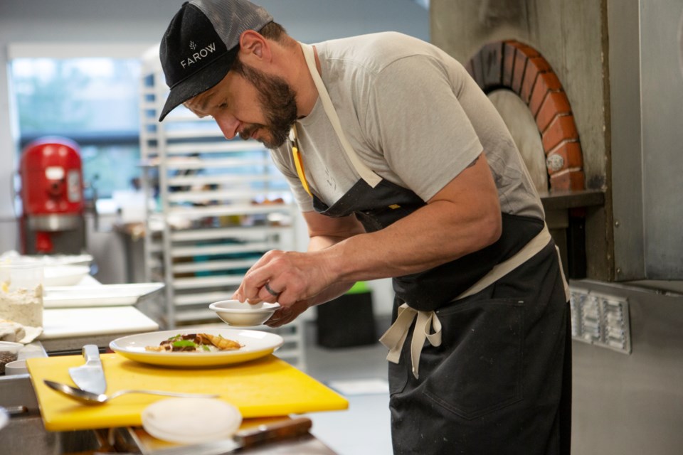Farow Restaurant sous chef Michael Schorn plating an oyster mushroom small plate on Aug. 23. The restaurant Sept. 4 and will have a changing menu depending on what is in season and can be found locally. Photos by Ali Mai | ali.mai.journo@gmail.com