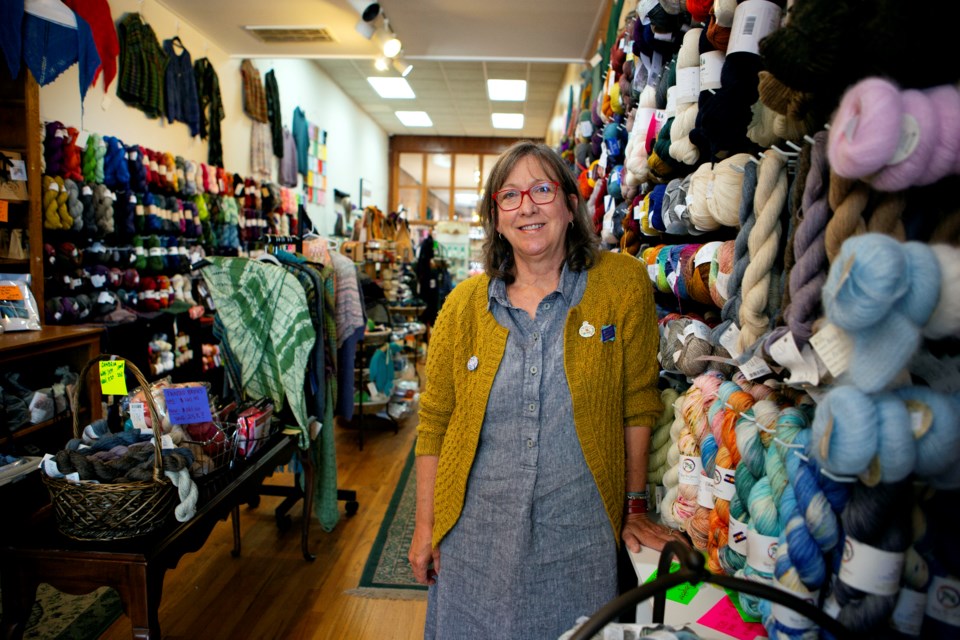 The Longmont Yarn Shoppe owner Gail Sundberg-Douse stands by the yarn sold in the downtown store on July 8. Photo by Ali Mai | ali.mai.journo@gmail.com