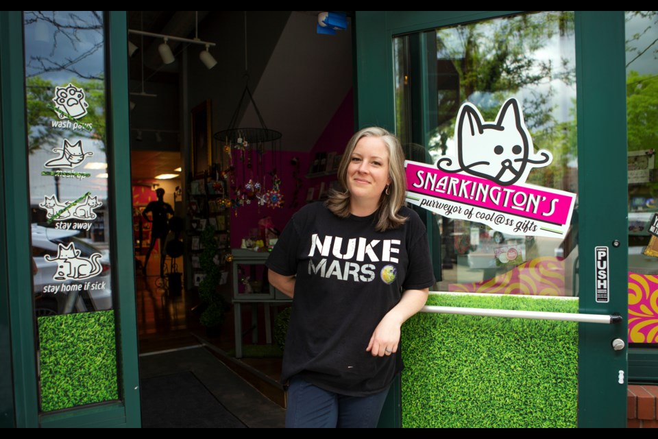 Snarkingtonâs Gifts owner Lisa Patchem stands in the entrance of the novelty gift shop on Main Street in downtown Longmont on June 1. Photo by Ali Mai | ali.mai.journo@gmail.com