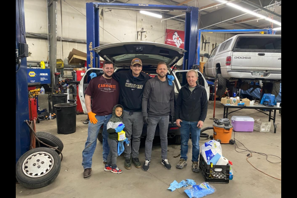 Community volunteers came to help at PEARL's Car Care Clinic at All American Auto Repair in Longmont on Saturday.