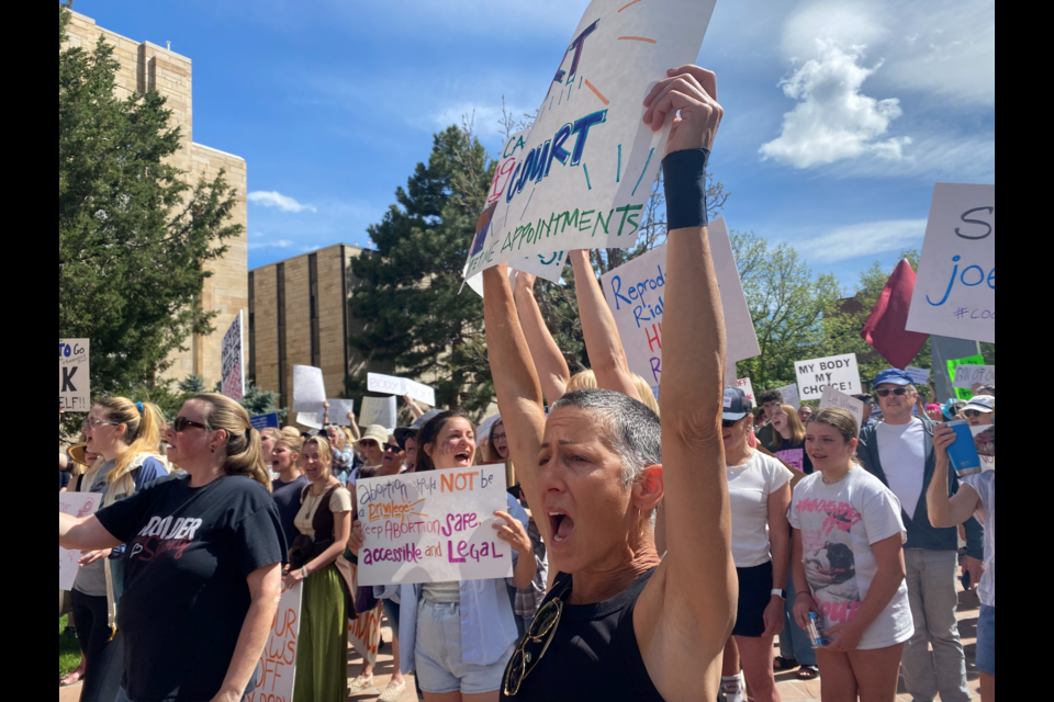 Protestors gather on May 14, 2022 at a Women's March in downtown Boulder. 