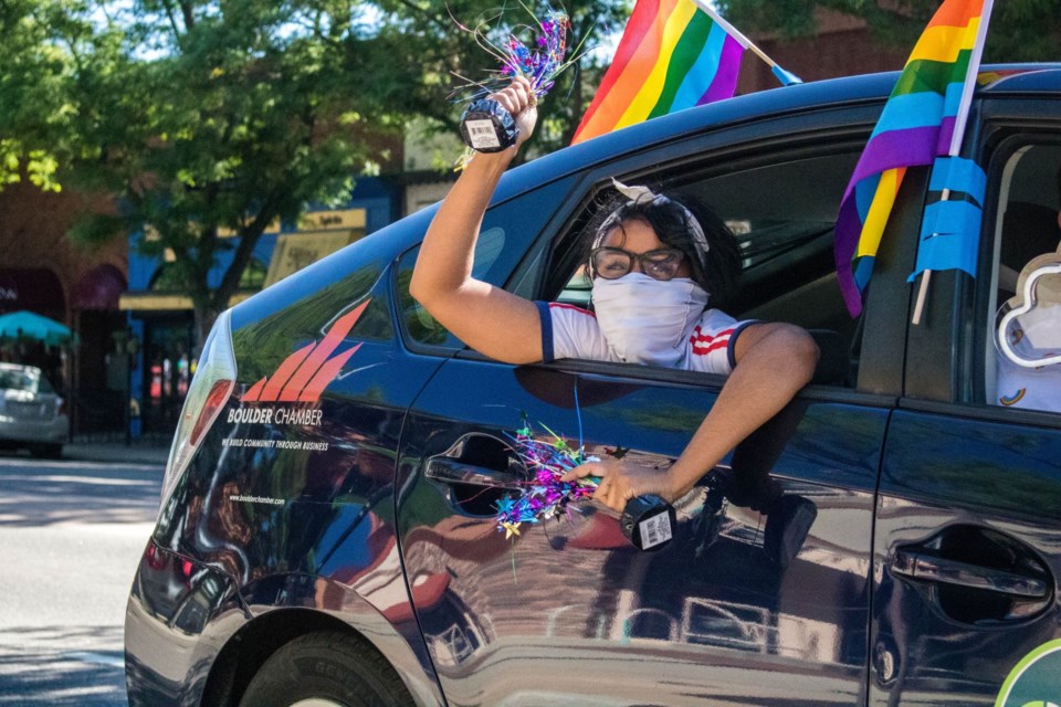 Youth celebrating Longmont Pride in 2020 motorcade down Main Street, Longmont.