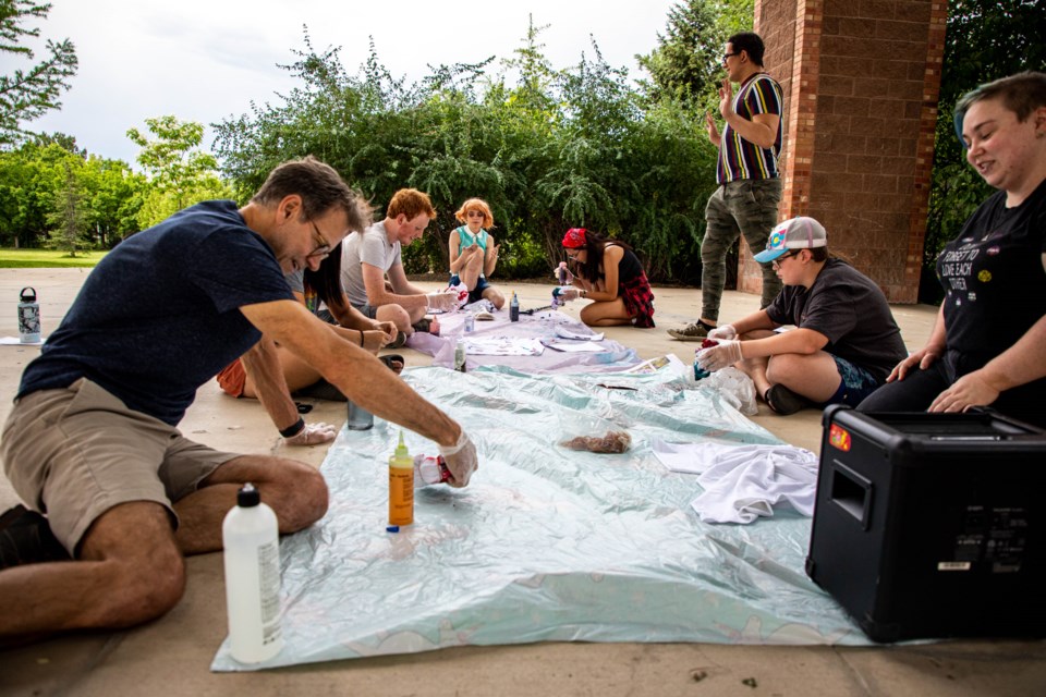 Out Boulder County's teen group meets under the pavilion in Roosevelt Park to make tie-dyed shirts.