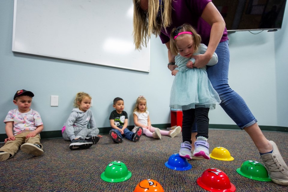 File photo. Physical Therapist Nicole Sauer helps 3-year-old Addy R. balance through the course while she participates in the Special Olympics Colorado Young Athletes Program at the TLC Learning Center on Thursday, April 1, 2021. / Kort Duce