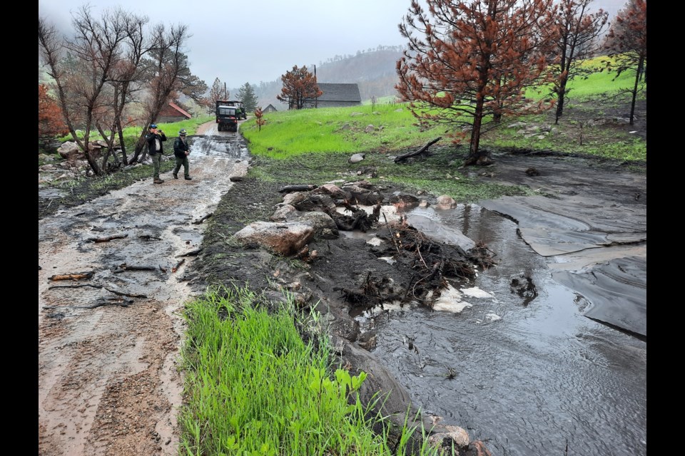 BCOS staff assessing damage caused by the flooding Sunday.