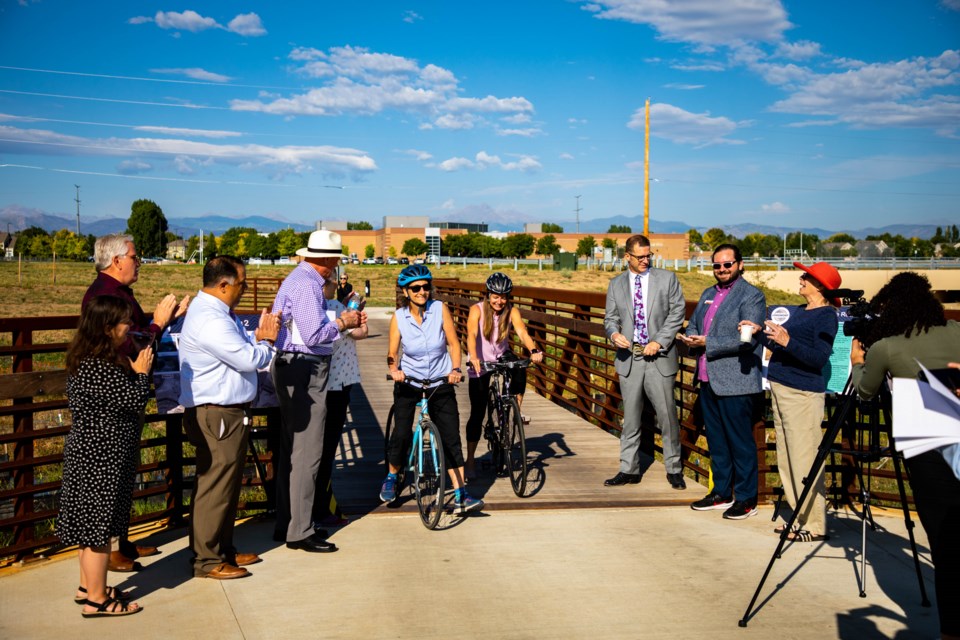 Mayor Bagley, councilmembers and city staff were onhand to cut the construction tape "ribbon" on the new Spring Gulch #2 crossing over the creek.