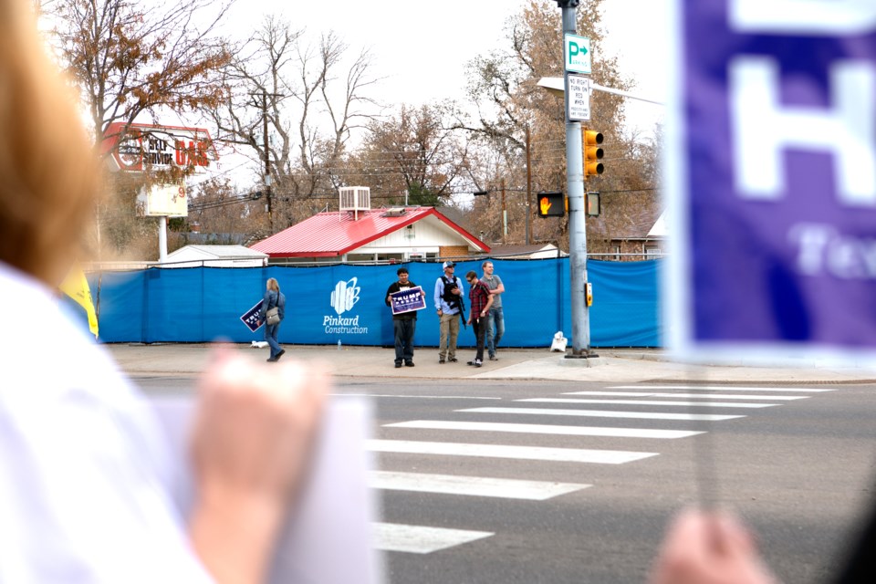  A group of demonstrators on Saturday afternoon protested against the 2020 presidential election results on Main Street and 6th Avenue. The small group was across the street from Longmont residents celebrating Joe Biden winning his bid for the presidency on Nov. 7. Photo by Ali C. M. Watkins