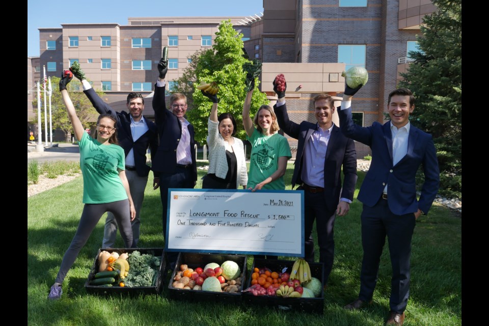 Left to right: Longmont Food Rescue Executive Director Naomi Curland; Longmont United Hospital Director of Finance Josh Butts; Longmont United Hospital Chief Medical Officer Dr. Tony Pearson;  Longmont United Hospital Chief Executive Officer TIna Johnson; Longmont Food Rescue Founder & Treasurer Kelly Mahoney; Longmont United Hospital Chief Operating Officer Andrew Ritz; and Longmont Chamber CEO Scott Cook at Longmont United Hospital met on Friday, June 4 to present Longmont Food Rescue with a $1,500 donation to support the organization's effort to relieve food insecurity in the Longmont community. 
Photo courtesy of Longmont Area Chamber of Commerce.