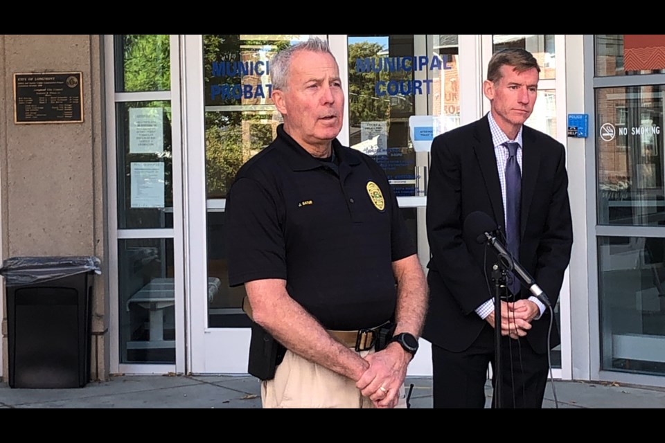 Deputy Chief of Police Services Jeff Satur and Boulder County District Attorney Michael Doughtery share information about the shooting of a postal worker in southwest Longmont during a press conference